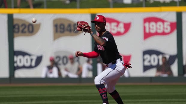 Mar 2, 2024; Goodyear, Arizona, USA; Cleveland Guardians shortstop Brayan Rocchio (4) fields a ground ball against the Kansas City Royals during the second inning at Goodyear Ballpark. Mandatory Credit: Joe Camporeale-USA TODAY Sports